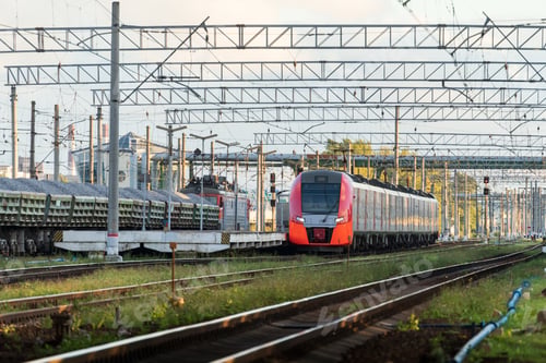 Preview: Modern intercity high speed train at sunset. Commercial suburban transportation concept.