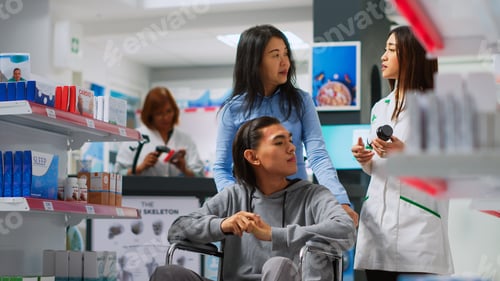 Preview: Male wheelchair user coming to pharmacy to buy pills