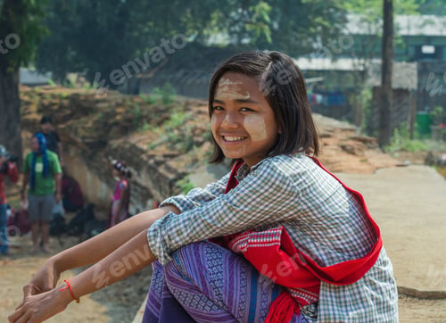 Preview: Burmese girl with traditional thanaka on her face, Myanmar
