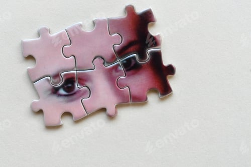 Preview: Mental health psychology concept - puzzle pieces with female's eyes