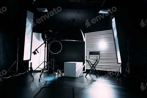 Preview: Modern photo studio with professional equipment. Black cyclorama.