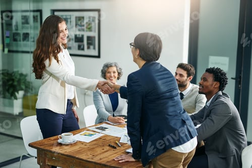 Preview: Deal. Cropped shot of two businesswomen shaking hands during a meeting.