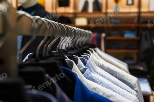 Preview: Shirts shopping close-up on hangers.