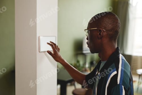 Preview: African American Man Using Automated Home System