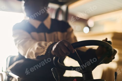 Preview: Black foreman worker driving forklift