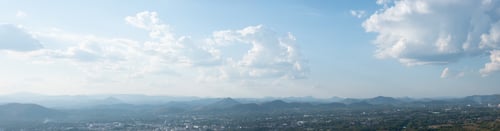 Preview: Beautiful sun sky cloud at the mountain range and the city in the background