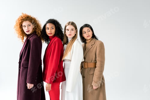 Preview: attractive blonde and redhead women standing with african american girls on white