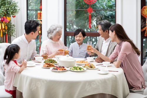 Preview: Happy family having Chinese New Year dinner
