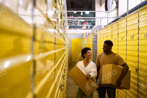 Preview: African American guy and girlfriend with cardboard boxes