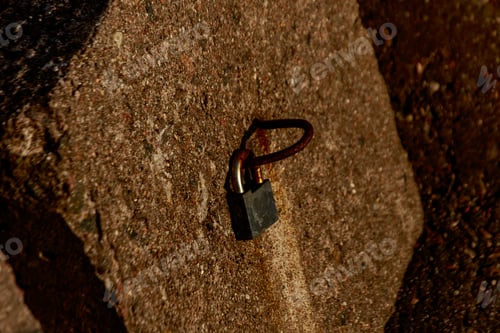 Preview: Closeup shot of a metal rusty lock on the gate to the port of Klaipeda