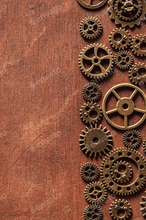 Preview: steampunk mechanical cogs gears wheels on wooden background
