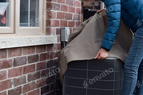 Preview: Putting cover on air conditioner unit