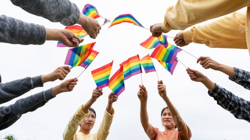 Preview: LGBTQ Rainbow Flags being waved symbol of Diversity Gay and lesbian for Celebration gay pride parade