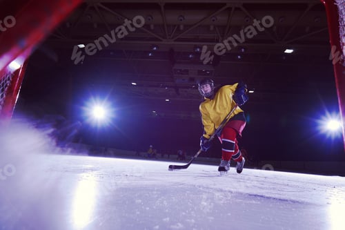 Preview: teen ice hockey player in action