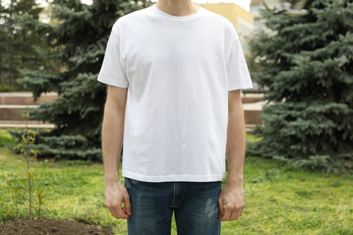 Preview: Man in blank white t-shirt. Outdoor photo