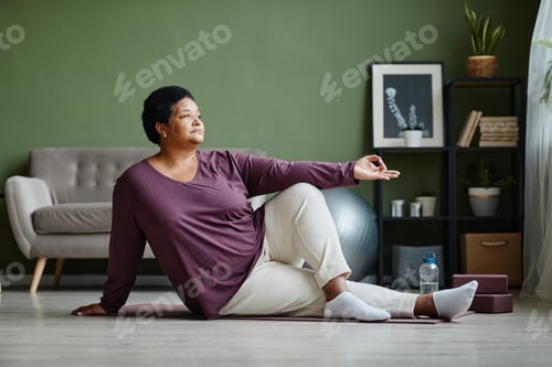 Preview: Active Senior Woman doing Yoga at Home