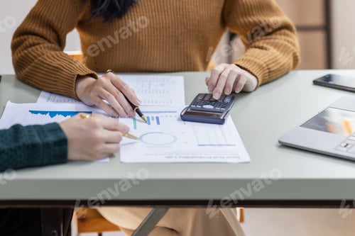 Preview: Financial Businesswomen analyze the graph of the company's performance to create profits and growth,