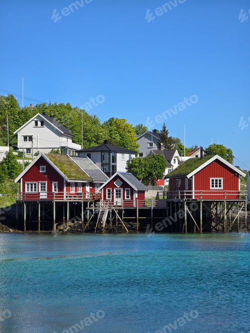 Preview: Charming Red Cabins on Stilts by Crystal Clear Waters in Norway's Coastal Village, Lofoten Norway