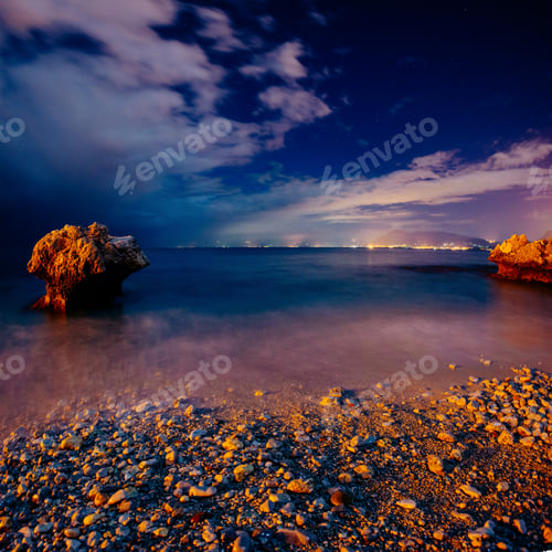 Preview: The starry sky above rocky mountains. Fantastic lighting city th