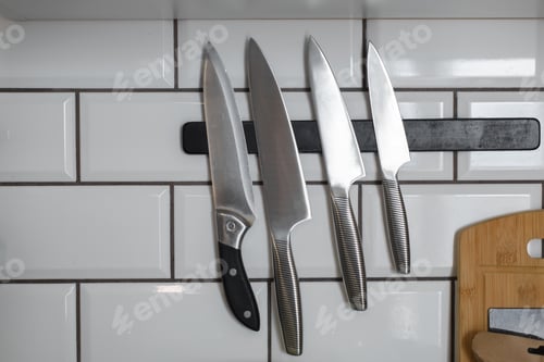 Preview: Sharp Kitchen Knives Hanging on Magnetic Strip