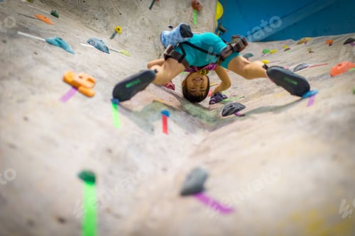 Preview: Girl rock climbing indoors
