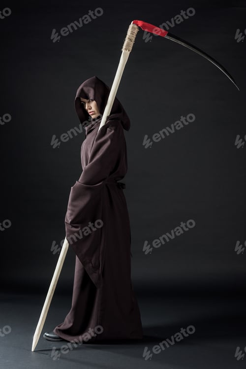 Preview: full length view of woman in death costume holding scythe on black