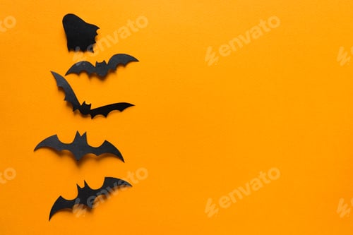 Preview: Halloween decorations, bats on orange background. Halloween party greeting card mockup