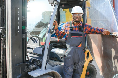 Preview: African American Man at work. Professional operation engineering. Young worker forklift driver