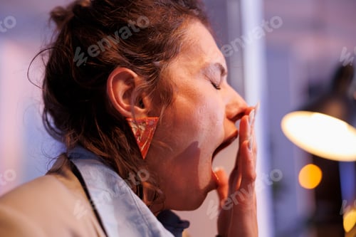Preview: Tired businesswoman working overhours at company strategy