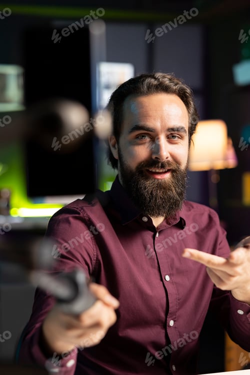 Preview: Internet star using smartphone on selfie stick to film vlog channel intro