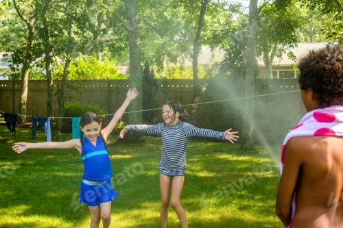 Preview: Three children playing garden with garden hose