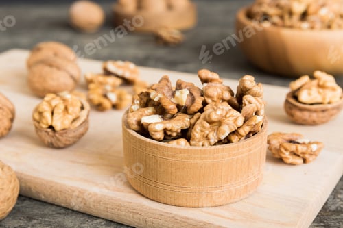 Preview: Fresh healthy walnuts in bowl on colored table background. Top view