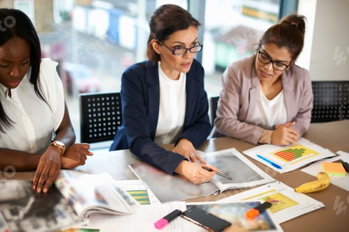 Preview: Colleagues having meeting at conference room table
