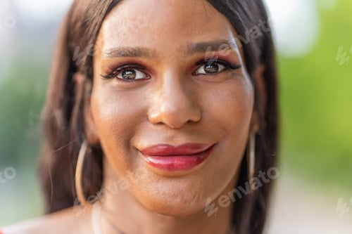 Preview: Close up portrait of a transsexual woman smiling at the camera