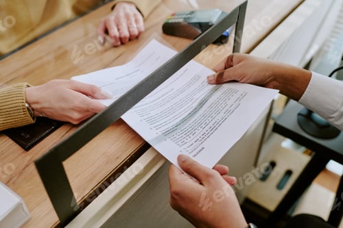 Preview: Signing Important Document at Office Counter