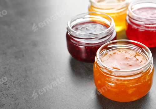 Preview: Jars with different sweet jam on grey background