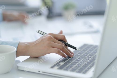 Preview: Business man working using laptop computer Hands typing keyboard.