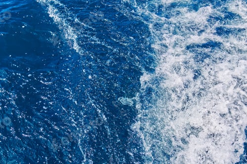 Preview: Abstract blue sea water with white waves. Blue sea texture with waves and foam. Mediterranean sea