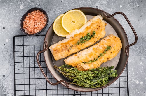 Preview: Baked Cod fish fiilet, fried whitefish meat. Grey background. top view