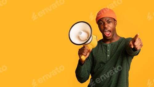 Preview: Attention. Emotional Black Guy With Megaphone Shouting And Pointing Finger At Camera