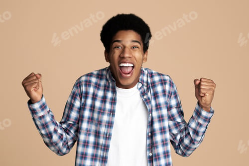 Preview: Yes, I did it! Guy celebrating victory over white background