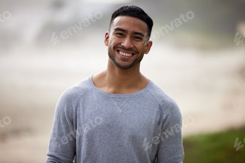 Preview: Theres nothing more attractive than a smiling face. Shot of a happy young man standing outside.