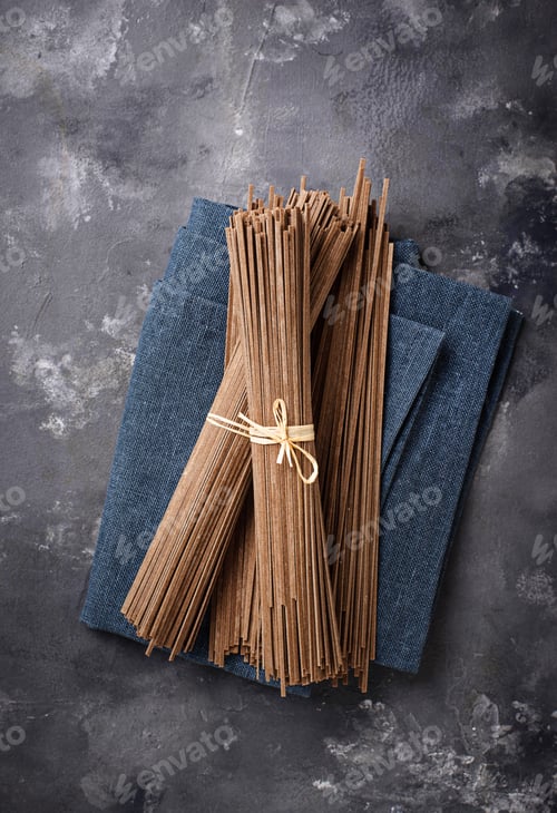 Preview: Raw uncooked Japanese soba noodles on grey bacground