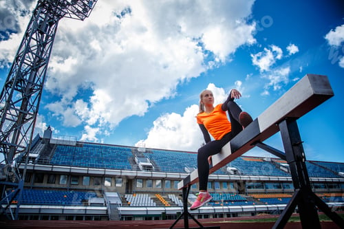 Preview: Slim female on the stadium.