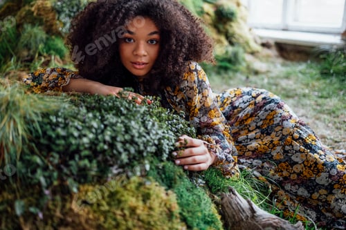 Preview: Fashion and beauty shooting a charming mixed race girl in a long dress