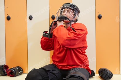 Preview: Female Hockey Player Getting Ready in Locker Room