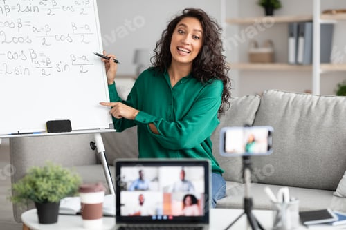 Preview: Math teacher showing board, giving virtual lecture to students