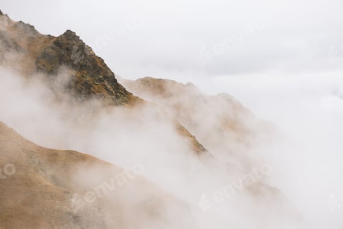 Preview: Mountain peak in the clouds