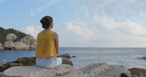 Preview: Woman enjoy the view of the sea at summer time