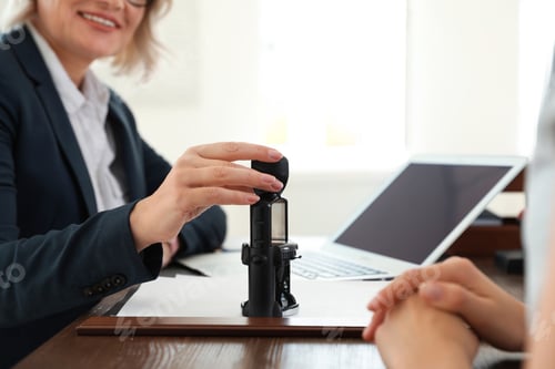 Preview: Female notary working with client in office